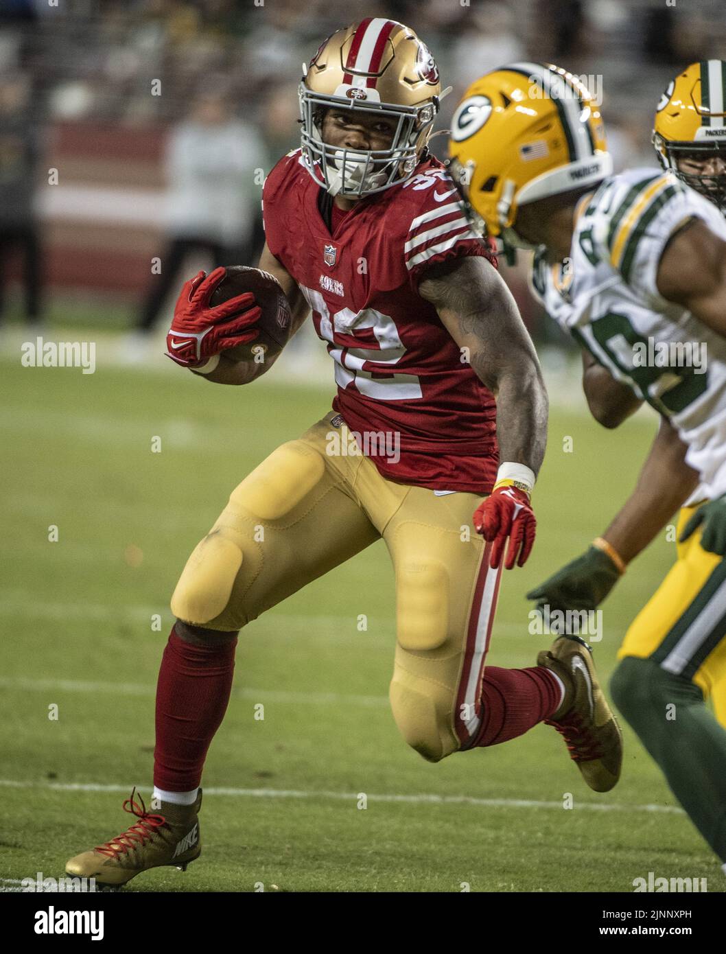 Santa Clara, USA. 13th Aug, 2022. San Francisco 49ers running back Tyrion Davis-Price (32) runs against the Green Bay Packers in the fourth quarter at Levi's Stadium in Santa Clara, California on Friday, August 12, 2022. The 49ers defeated the Packers 28-21 in their first preseason game Photo by Terry Schmitt/UPI Credit: UPI/Alamy Live News Stock Photo