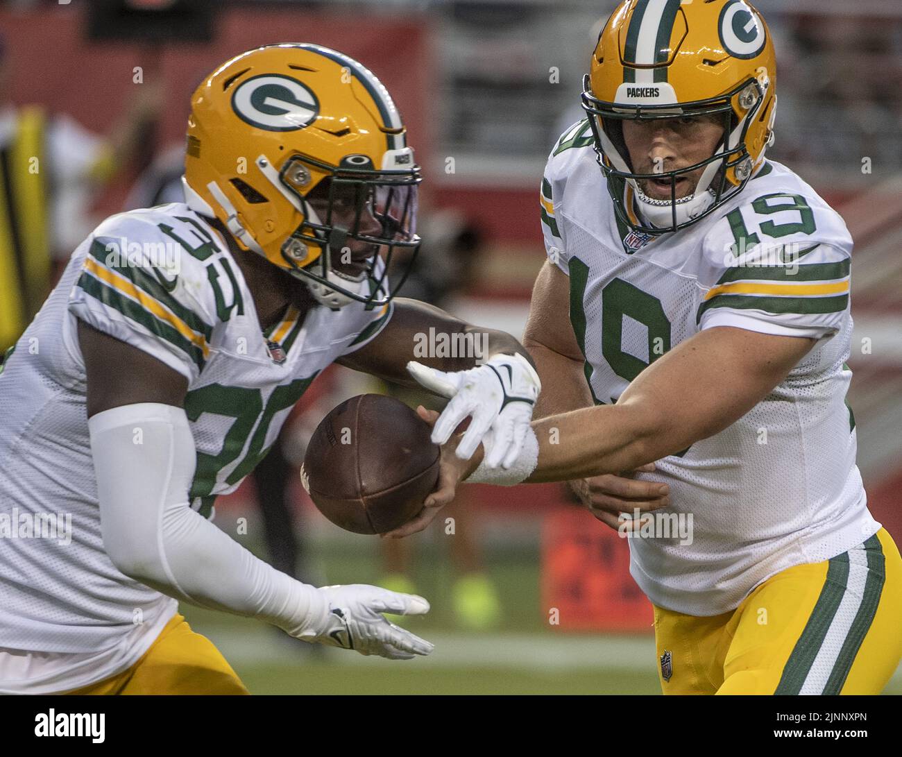 Santa Clara, USA. 13th Aug, 2022. Green Bay Packers quarterback Danny Etling (19) hands off to running back BJ Baylor (35) in the third quarter against the San Francisco 49ers at Levi's Stadium in Santa Clara, California on Friday, August 12, 2022. The 49ers defeated the Packers 28-21 in their first preseason game Photo by Terry Schmitt/UPI Credit: UPI/Alamy Live News Stock Photo