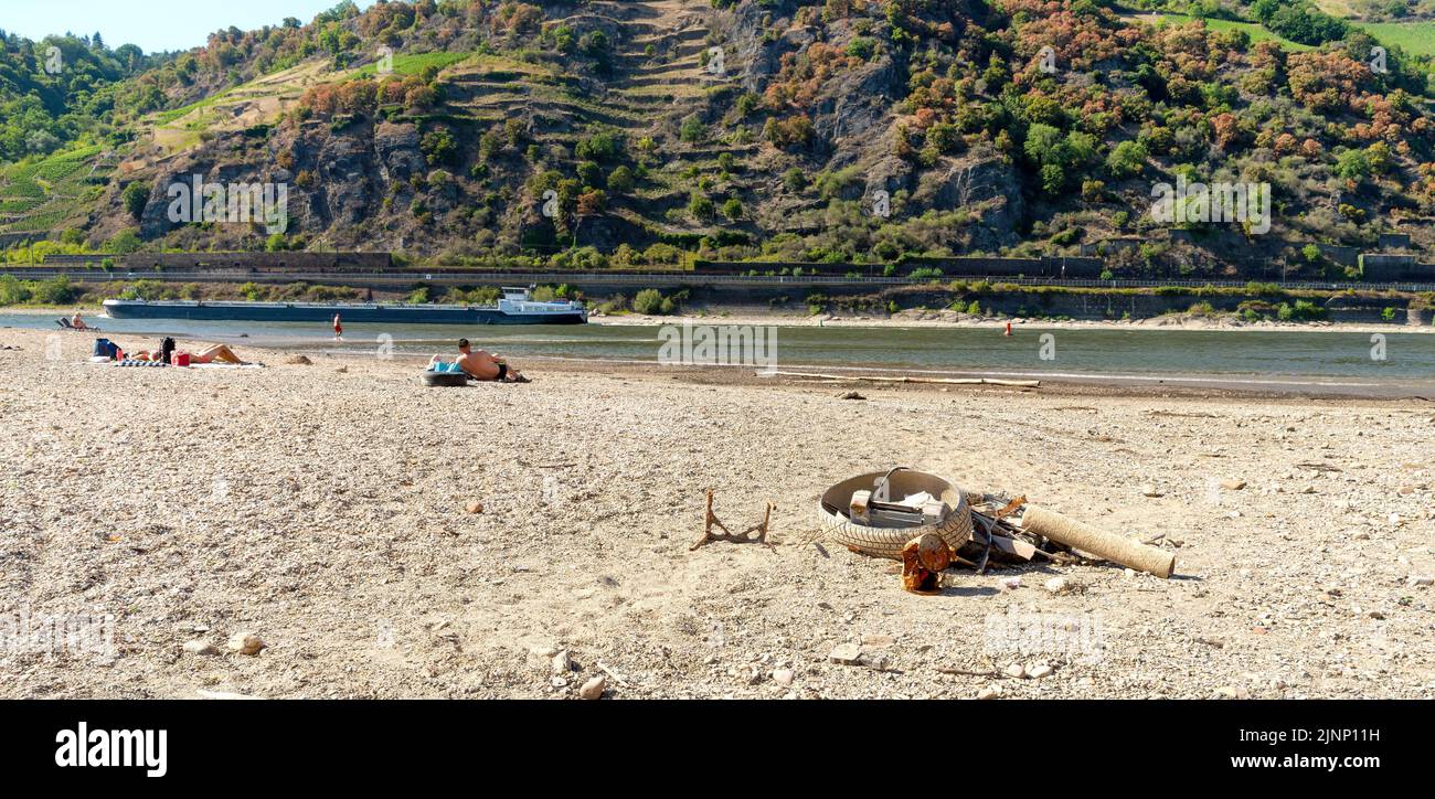 Cargo ship on the Rhine at low water near the Loreley Stock Photo