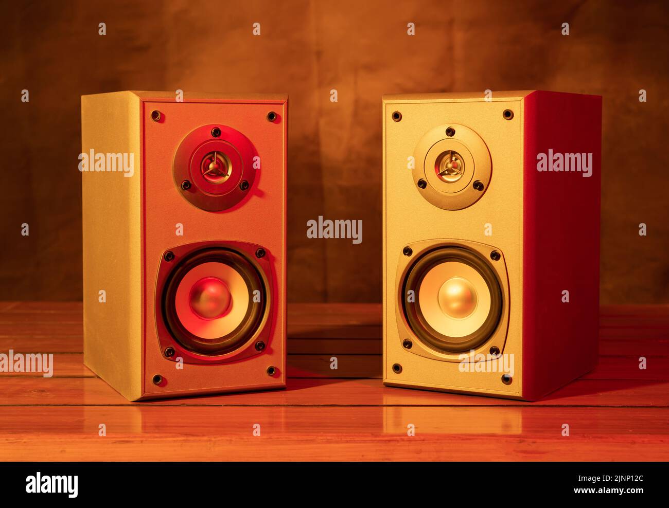 Two audio speakers with yellow and red bar lights closeup view. Stock Photo