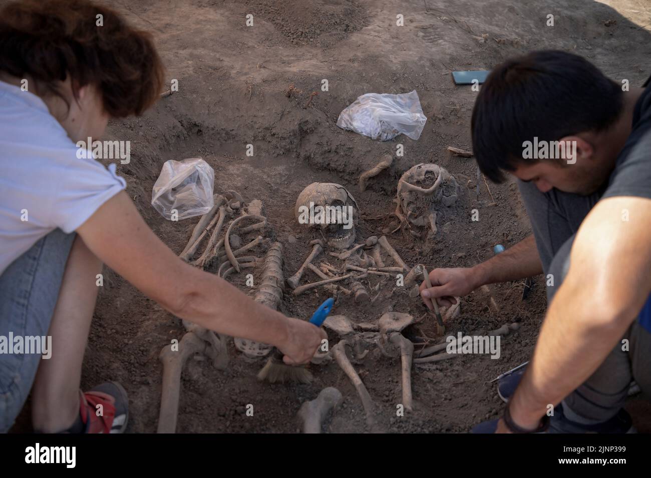 Vinča, Serbia, Sep 4, 2021: Close-up of archaeologists working on human remains excavation Stock Photo