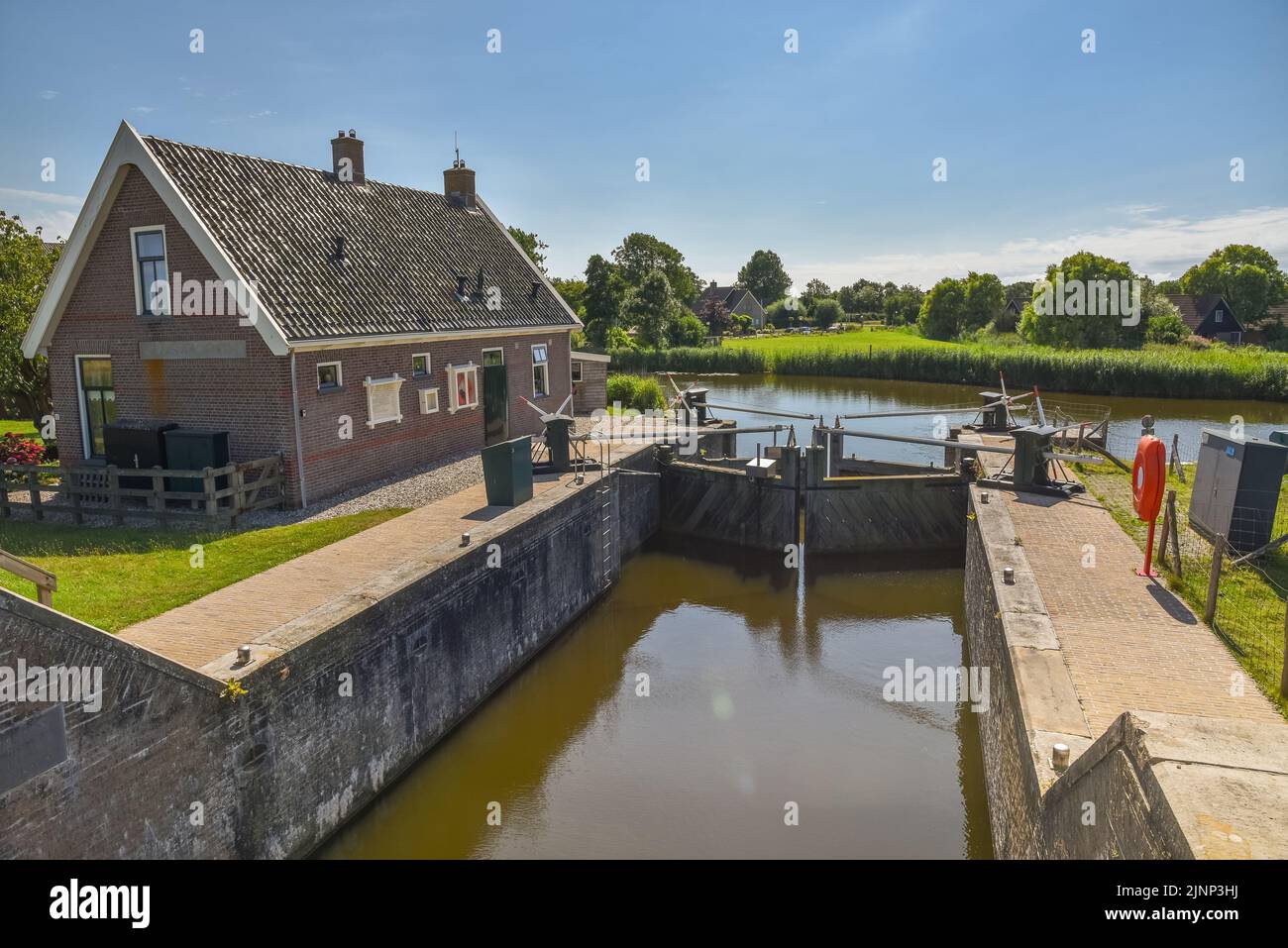 Oudesluis, Netherlands. August 2022. A small manually operated lock in the polder of North Holland. High quality photo Stock Photo