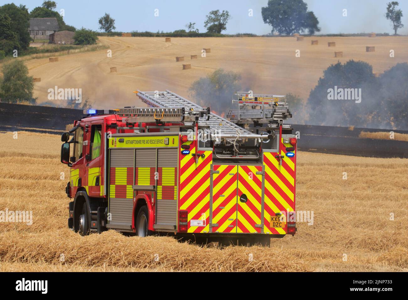 7-8-2022 Firefighters and farmers tackle a massive field fire in a crop of standing Wheat close to the village of Ridlington, Rutland  ©Tim Scrivener Photographer 07850 303986      ....Covering Agriculture In The UK.... Stock Photo