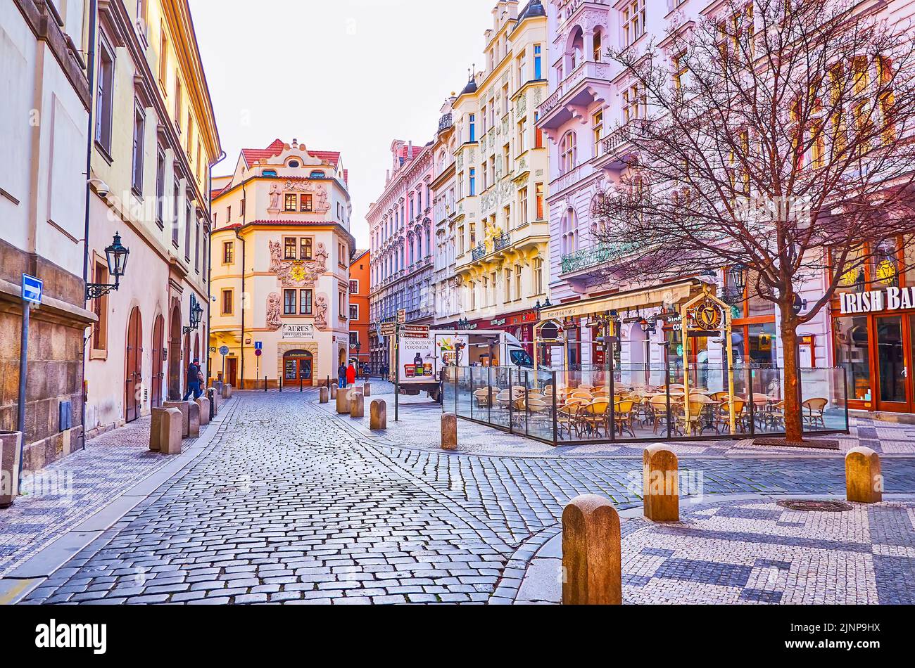 PRAGUE, CZECH REPUBLIC - MARCH 6, 2022:  Historic Karlova Street with House at the Golden Well (Dum u Zlate Studne) with wall sculptures and decors, o Stock Photo