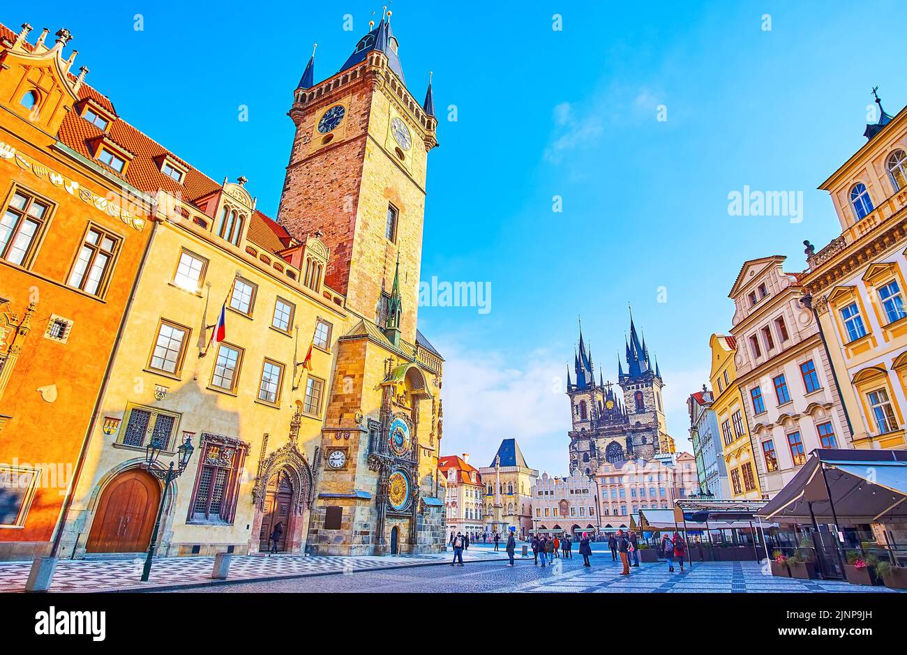 PRAGUE, CZECH REPUBLIC - MARCH 6, 2022: Old Town Square with Old Town Hall with Prague Orloj astronomical clock and Tynsky Church in background, on Ma Stock Photo