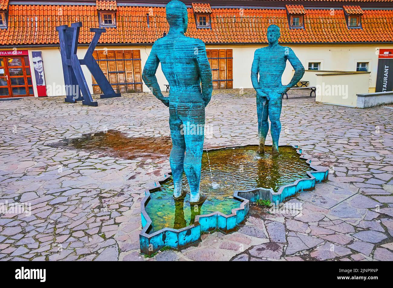 PRAGUE, CZECH REPUBLIC - MARCH 6, 2022:   The unique Piss statue by David Cerny, located in Lesser Quarter (Mala Strana) in front of Franz Kafka Museu Stock Photo