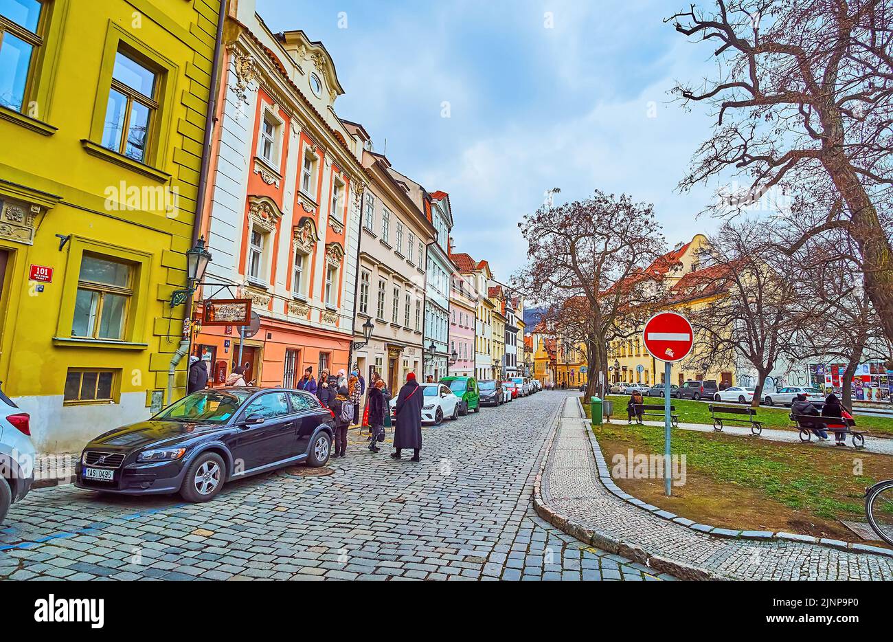 PRAGUE, CZECH REPUBLIC - MARCH 6, 2022: U Luzickeho Seminare Street in Lesser Quarter with line of colored historic houses and small green park with t Stock Photo