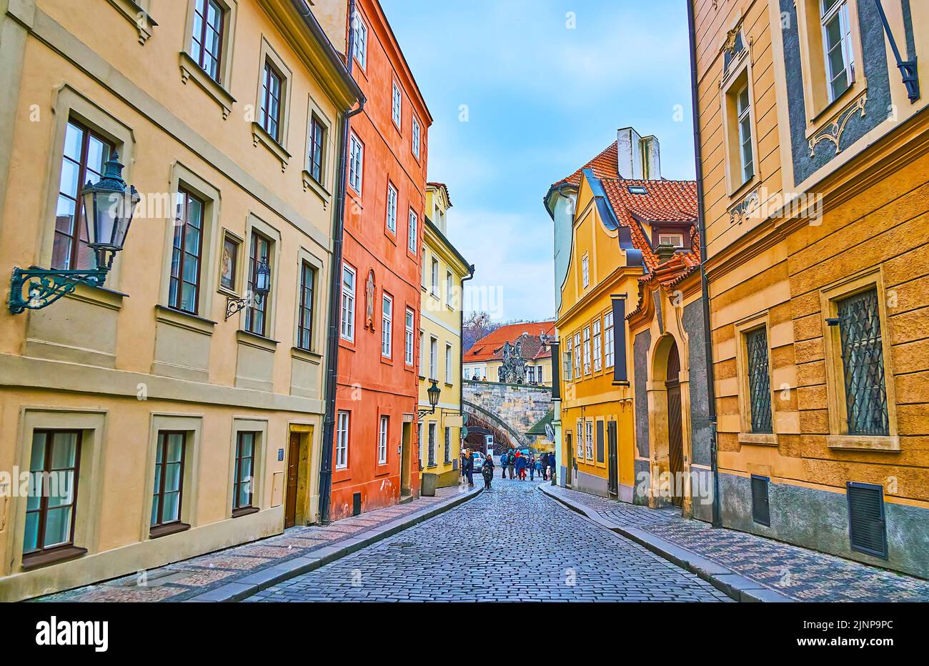 Walk down the narrow street of Mala Strana (Lesser Quarter), lined with beautiful colored houses with museums, restaurants and hotels, Prague, Czech R Stock Photo