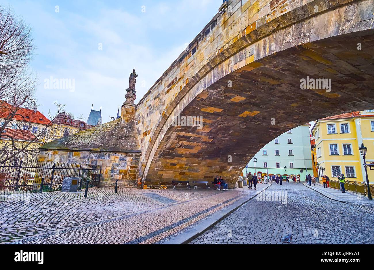 The old Na Kampe street runs under the medieval arched Charles Bridge, Mala Strana, Prague, Czech Republic Stock Photo