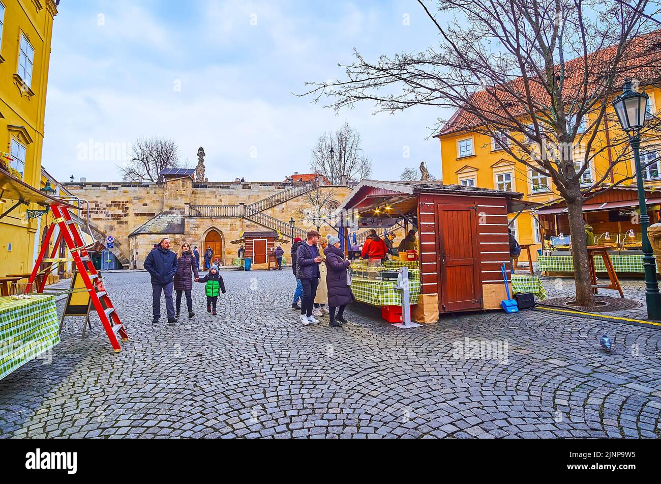 PRAGUE, CZECH REPUBLIC - MARCH 6, 2022: Na Kampe Street food market with the Charles Bridge in the background, on March 6 in Prague Stock Photo