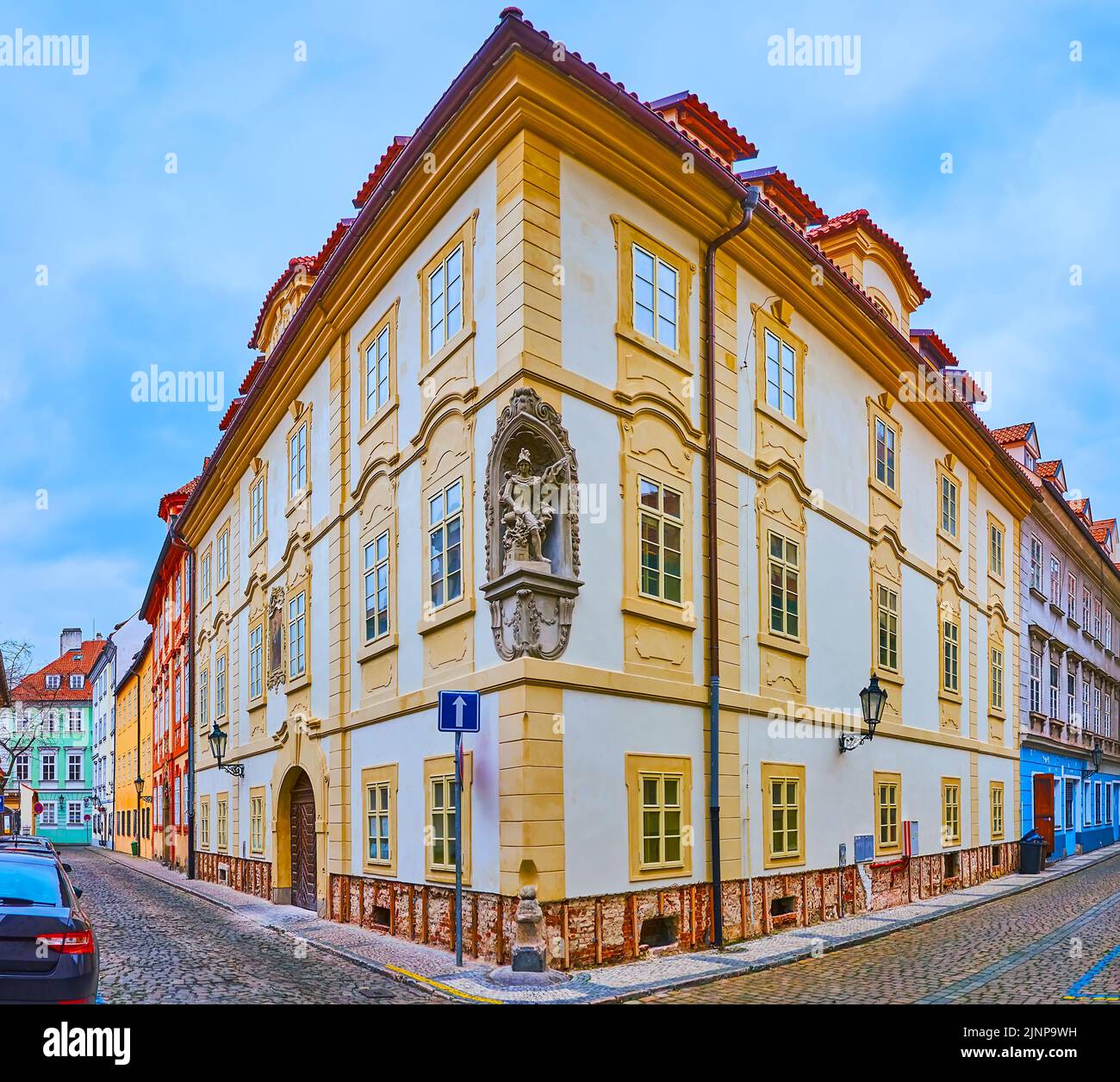 The corner of historic mansion, decorated with wall statue of St Florian, Nosticova Street, Mala Strana, Prague, Czech Republic Stock Photo