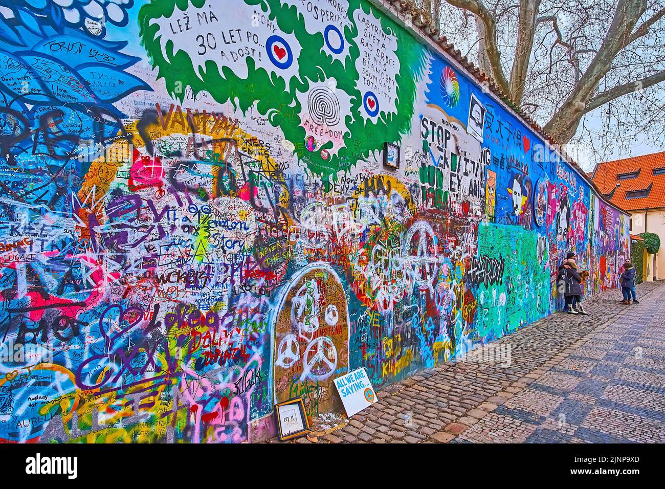 PRAGUE, CZECH REPUBLIC - MARCH 6, 2022: Lennon Wall memorial, located on Velkoprevorske (Grand Priory) Square of Lesser Quarter, on March 6 in Prague Stock Photo