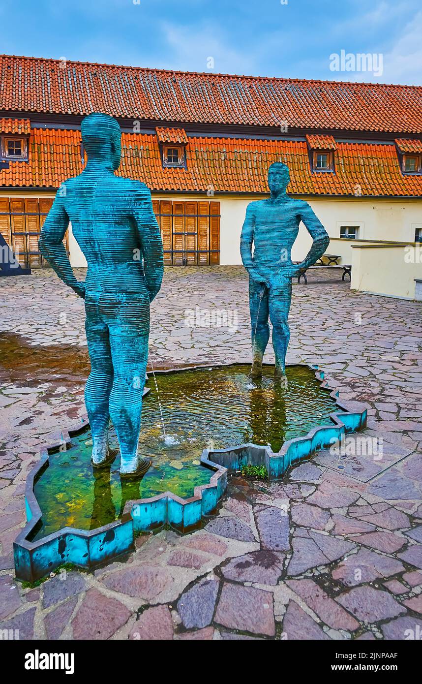 PRAGUE, CZECH REPUBLIC - MARCH 6, 2022:  The unusual Piss sculptural group by David Cerny, located in Lesser Quarter (Mala Strana) in front of Franz K Stock Photo