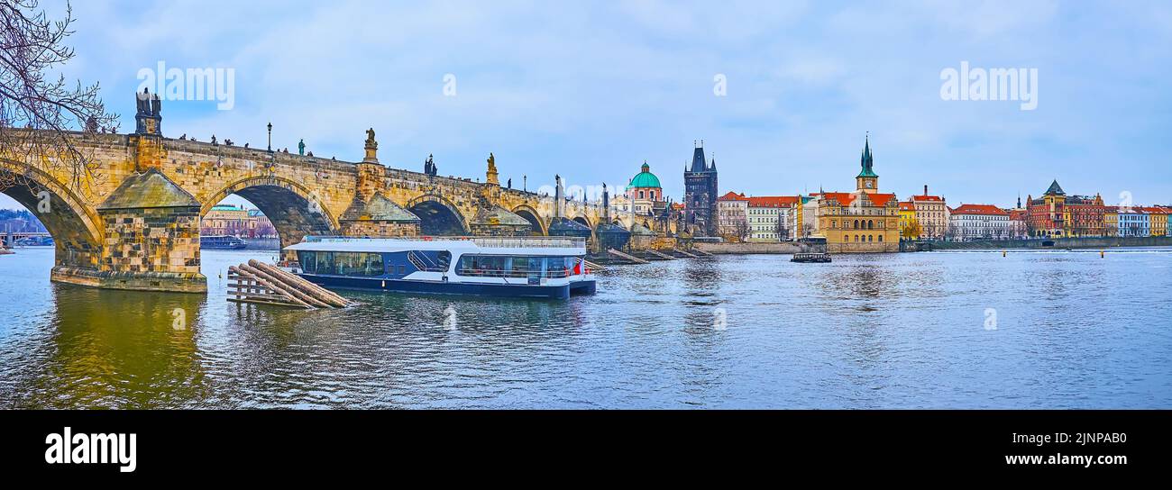 The Lesser Quarter embankment of Vltava River opens the view on Charles Bridge, Old Town Bridge Tower, Bedrich Smetana museum and Old Town Water Tower Stock Photo