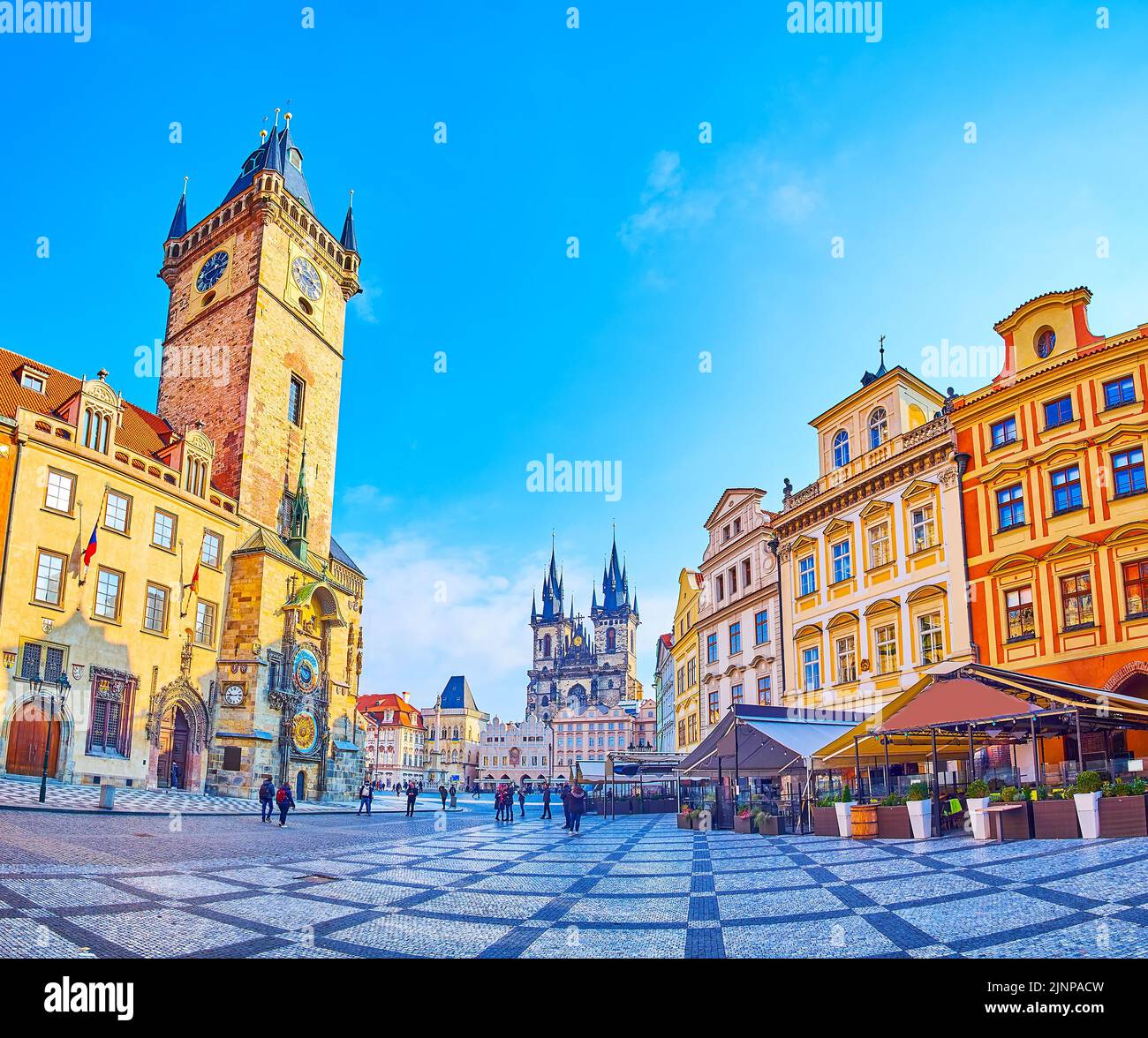PRAGUE, CZECH REPUBLIC - MARCH 6, 2022: The medieval stone Old Town Square with Old Town Hall, Prague Orloj astronomical clock, townhouses and Tynsky Stock Photo