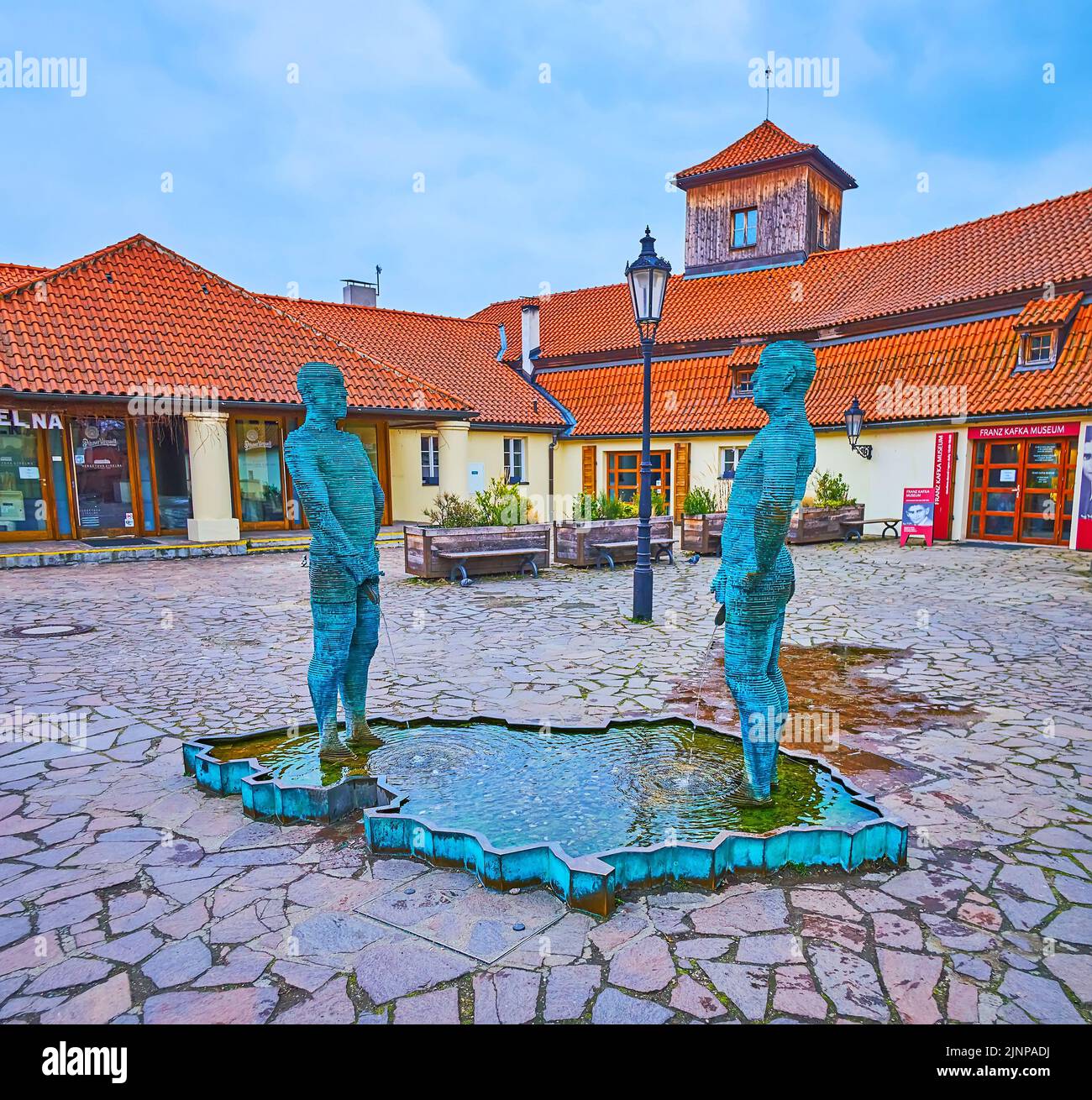 PRAGUE, CZECH REPUBLIC - MARCH 6, 2022:  The modern Piss sculptural group by David Cerny, located in Lesser Quarter in front of Franz Kafka Museum, on Stock Photo