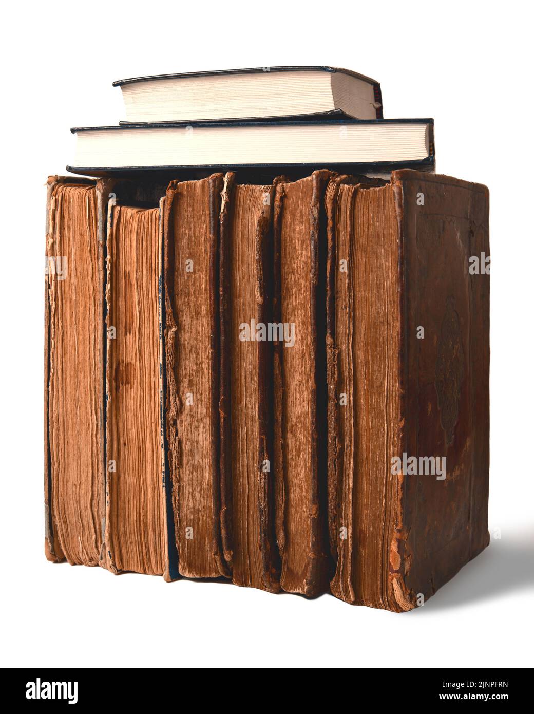 Old shabby and new books on white background. Old vs new concept. Closeup Stock Photo