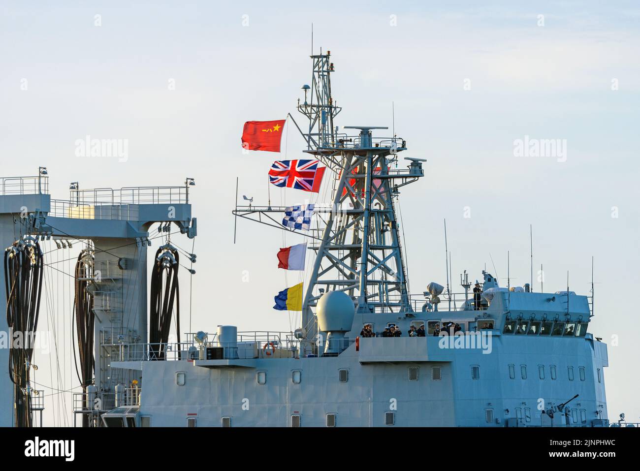 A Peoples Liberation Army Ensign and callsign flags flying from a Chinese warship - January 2015. Stock Photo