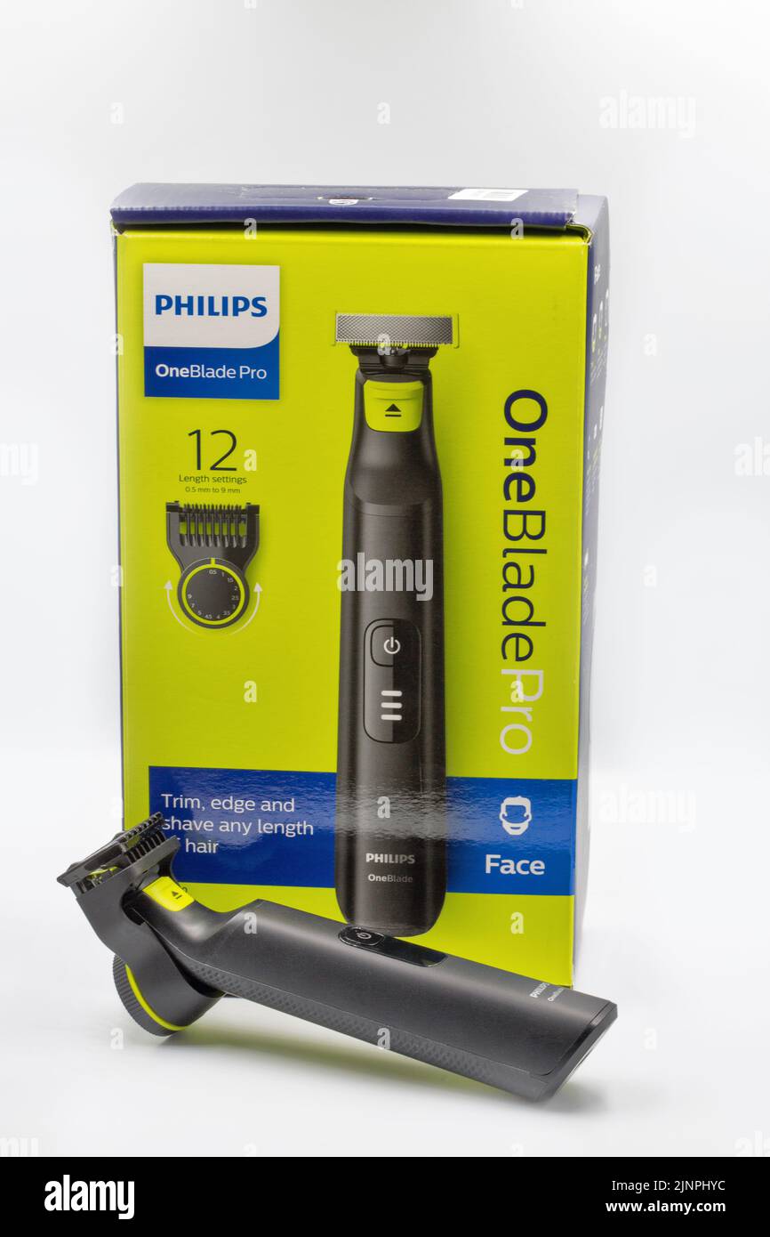 Kyiv, Ukraine - April 29, 2022: Studio shot of modern Philips One Blade Pro electric shaver closeup against white. Philips is a Dutch multinational co Stock Photo