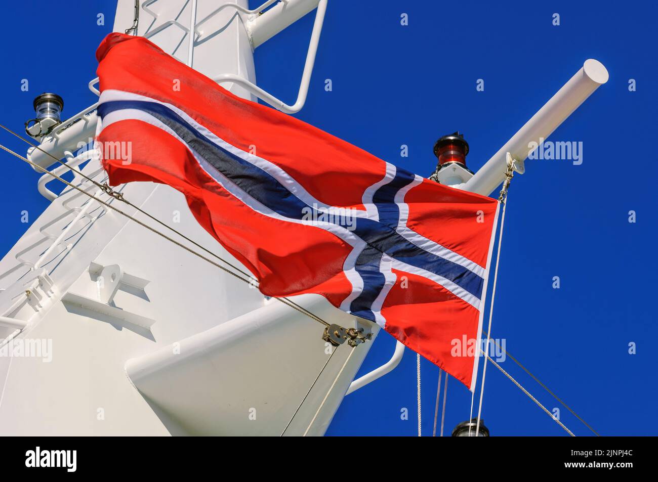 The Norwegian national flag flying from a cruise ship halyard - August 2005. Stock Photo