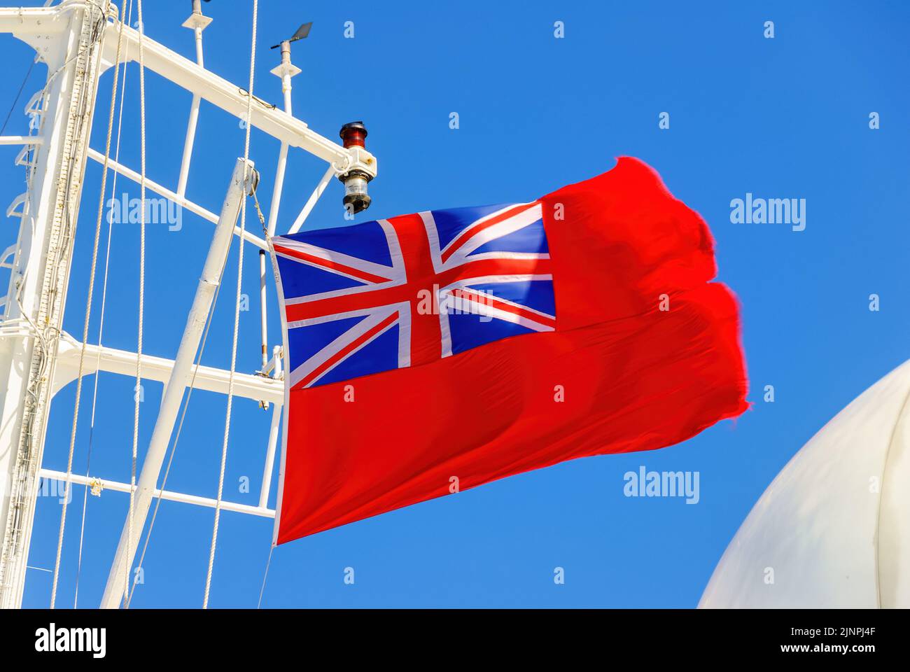 The Red Ensign is the national flag of the British merchant marine. Stock Photo