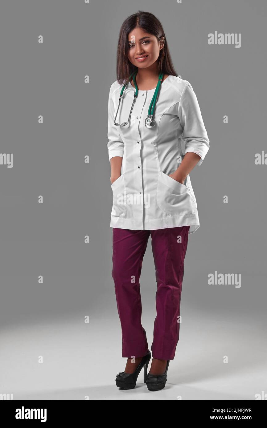 Beautiful young doctor in a medical robe with a stethoscope Stock Photo