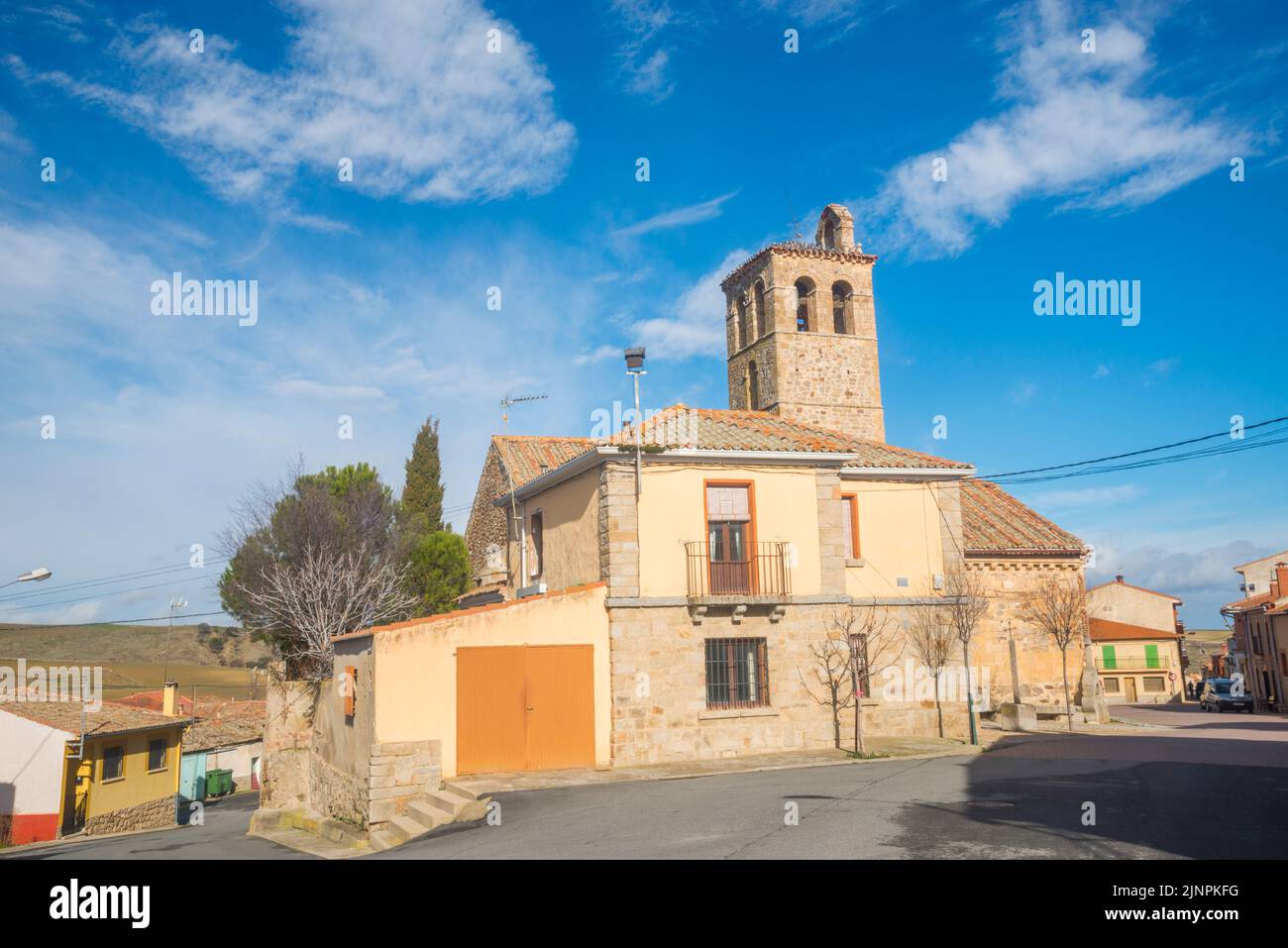 Facade of house and San Vicente church. Zarzuela del Monte, Segovia province, Castilla Leon, España. Stock Photo