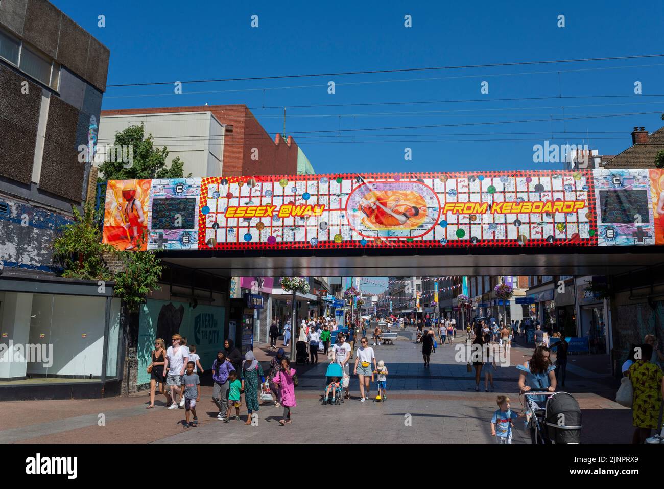 Colourful artwork on railway bridge over the High Street of Southend on Sea, Essex, UK. Families heading towards the beaches. Essex @way from keyboard Stock Photo