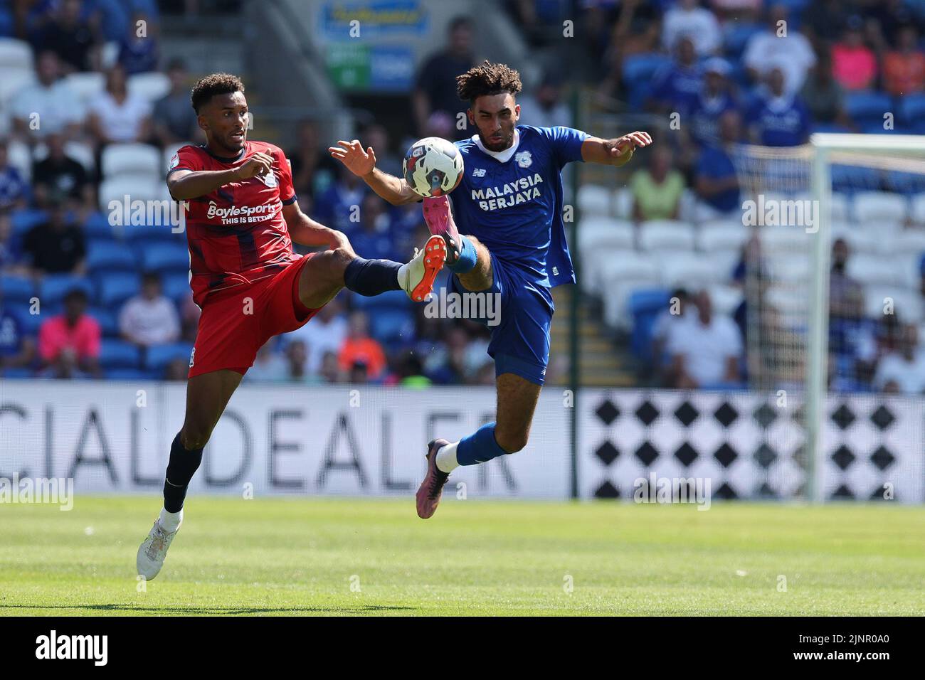 Cardiff, UK. 13th Aug, 2022. Kion Etete of Cardiff City (r) & Auston Trusty of Birmingham City in action. EFL Skybet championship match, Cardiff city v Birmingham City at the Cardiff City Stadium in Cardiff, Wales on Saturday 13th August 2022. this image may only be used for Editorial purposes. Editorial use only, license required for commercial use. No use in betting, games or a single club/league/player publications. pic by Andrew Orchard/Andrew Orchard sports photography/Alamy Live news Credit: Andrew Orchard sports photography/Alamy Live News Stock Photo