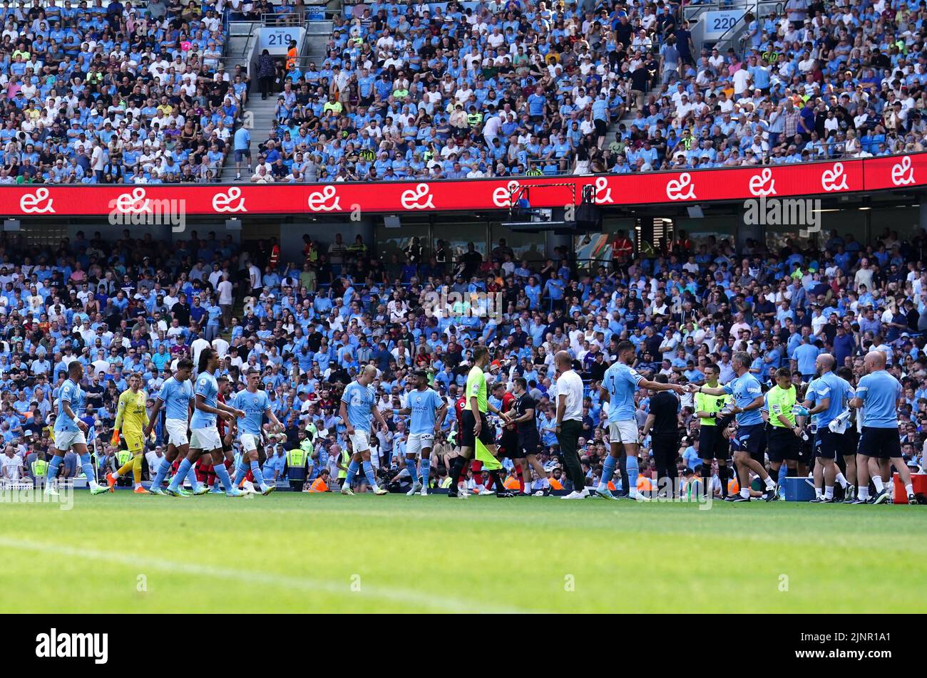 Manchester City and Bournemouth players walk off the pitch for a drinks break during the Premier League match at the Etihad Stadium, Manchester. Picture date: Saturday August 13, 2022. Stock Photo