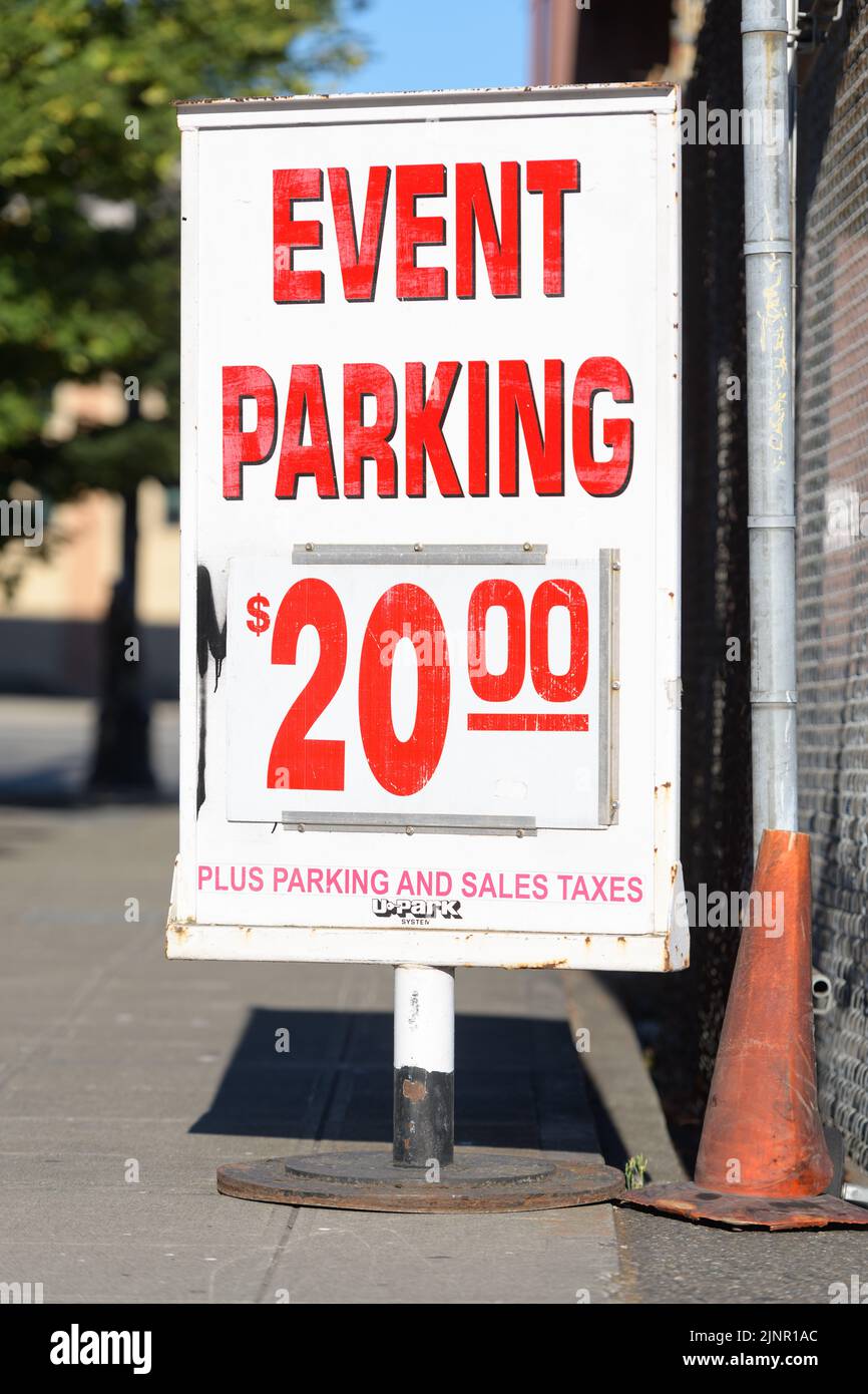 Seattle - August 07, 2022; Event Parking stand alone sign for $20 on a sidewalk in Seattle Stock Photo