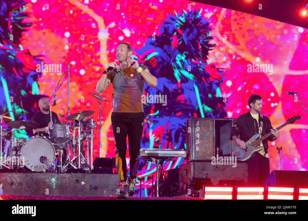 Will Champion of Coldplay performs on stage at Wembley Stadium