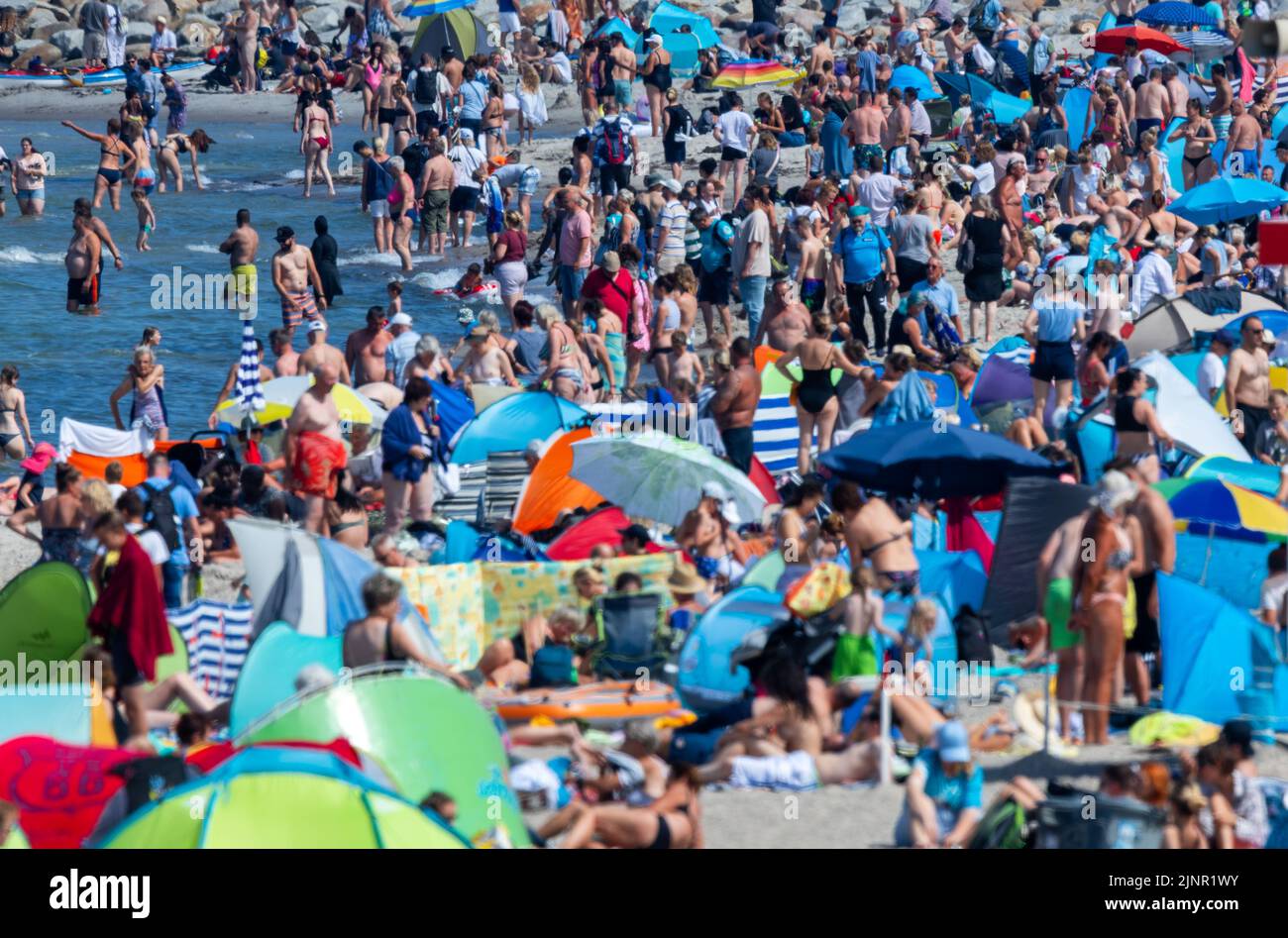 Rostock, Germany. 13th Aug, 2022. Tourists and day visitors take