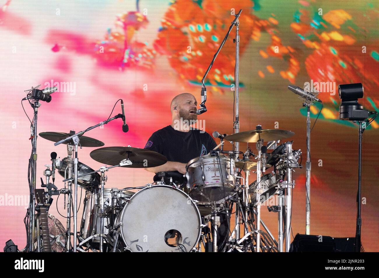 Will Champion of Coldplay performs on stage at Wembley Stadium