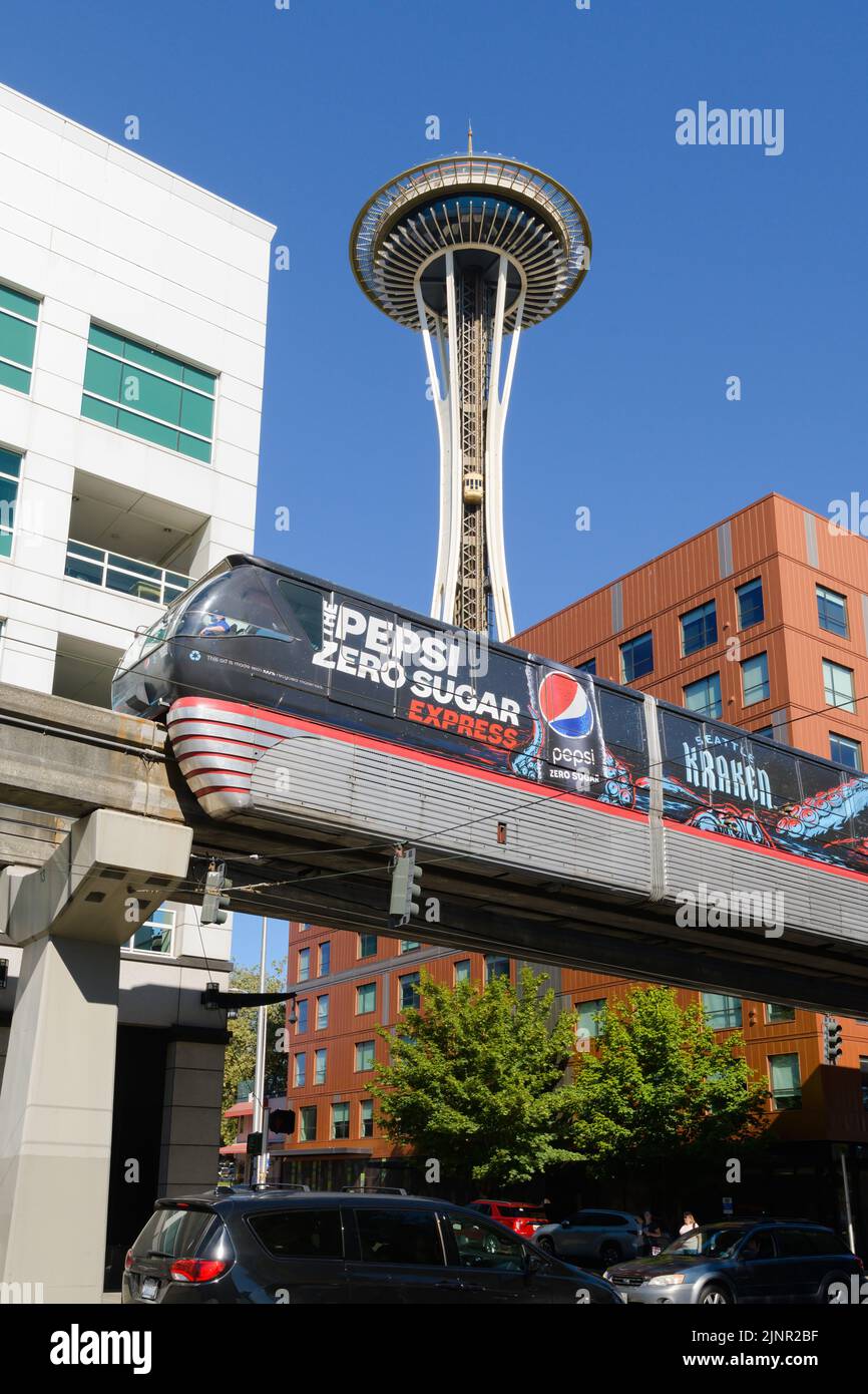 Seattle - August 07, 2022; Seattle monorail wrapped in Pepsi Zero Sugar advertising on elevated track infront of Space Needle Stock Photo