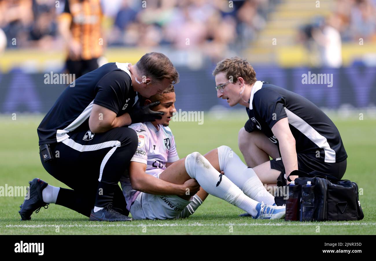 Norwich City's Max Aarons receives treatment for an injury during the Sky Bet Championship match at the MKM Stadium, Hull. Picture date: Saturday August 13, 2022. Stock Photo