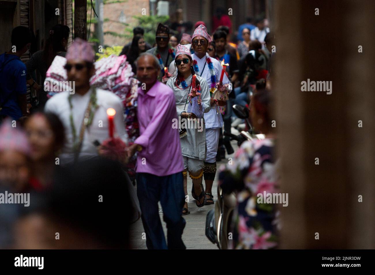 Lalitpur, Nepal. 13th Aug, 2022. People participate in a parade commemorating the Mataya festival, or the festival of lights, in Lalitpur, Nepal, Aug. 13, 2022. Credit: Sulav Shrestha/Xinhua/Alamy Live News Stock Photo