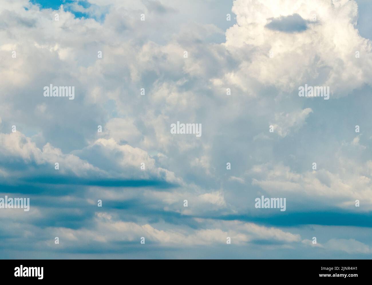 Dark rain clouds in grey sky Stock Photo