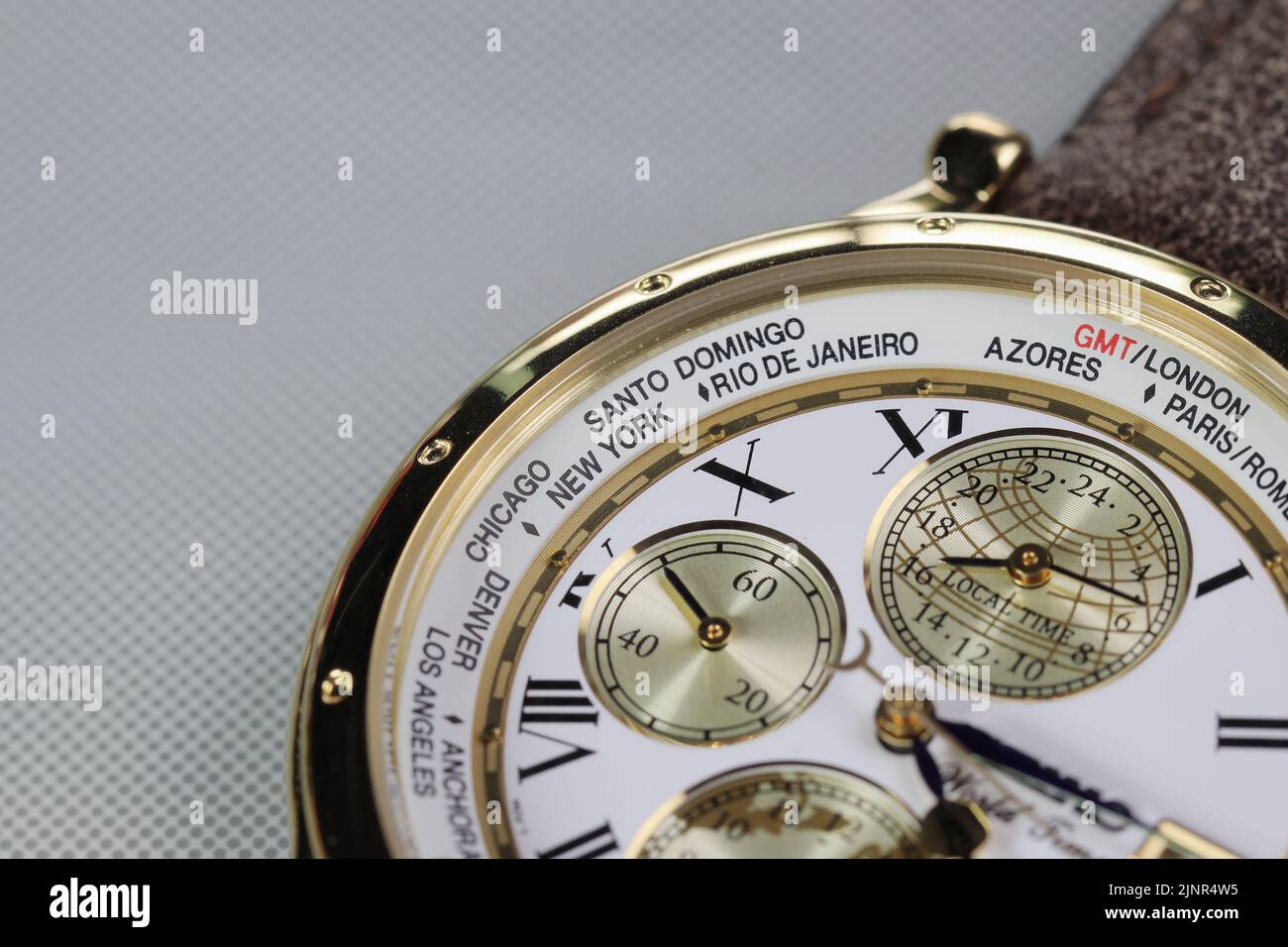 close up on Time zone cities name on luxury world time watch bezel. Stock Photo