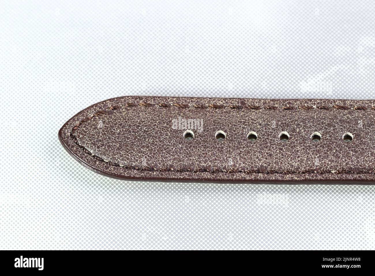 Closeup detail of luxury Watch straps, Genuine handcraft italian calfskin leather with white top stitching isolated on white background. Stock Photo