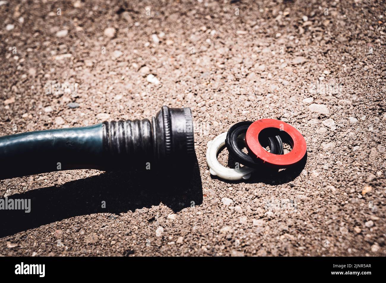 New rubber gasket being replaced in a garden hose female connection to