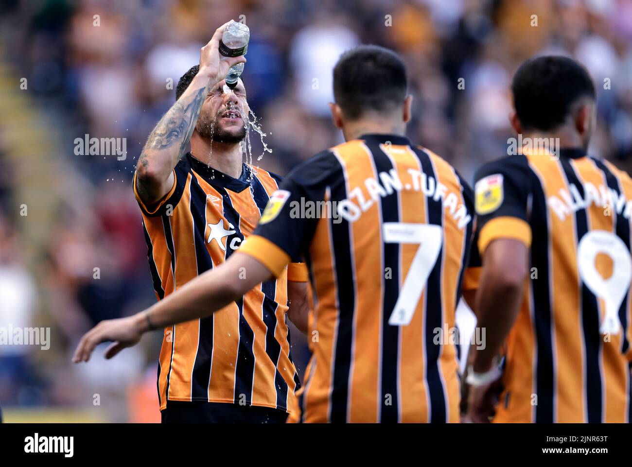Hull City's Tobias Figueiredo pours water on his face to cool down during the Sky Bet Championship match at the MKM Stadium, Hull. Picture date: Saturday August 13, 2022. Stock Photo