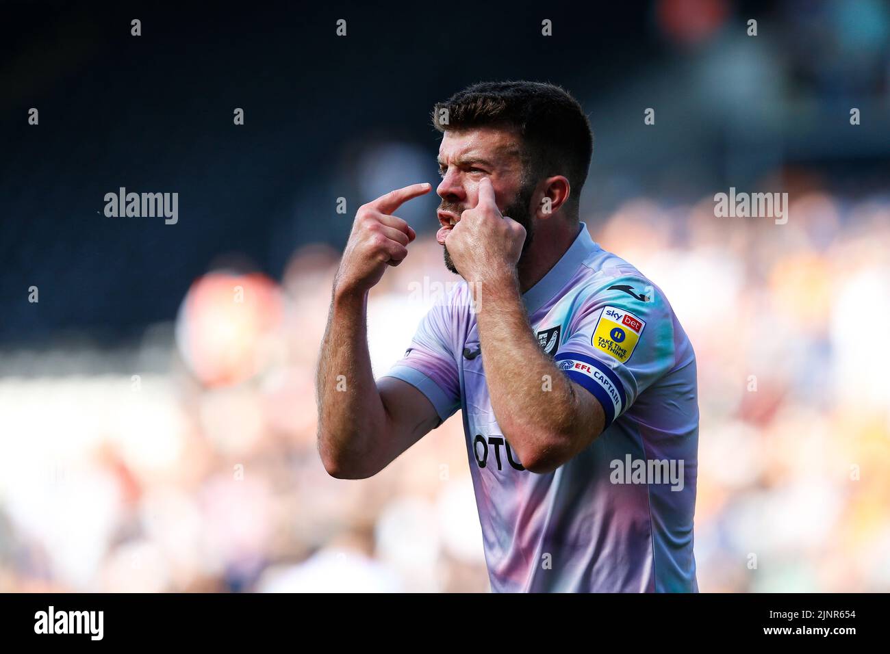 Grant Hanley #5 of Norwich City reacts at the linesman Stock Photo