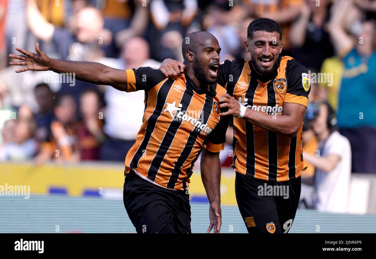 Hull City's Oscar Estupinan celebrates scoring their side's second goal of the game with team-mate Allahyar Sayyadmanesh during the Sky Bet Championship match at the MKM Stadium, Hull. Picture date: Saturday August 13, 2022. Stock Photo