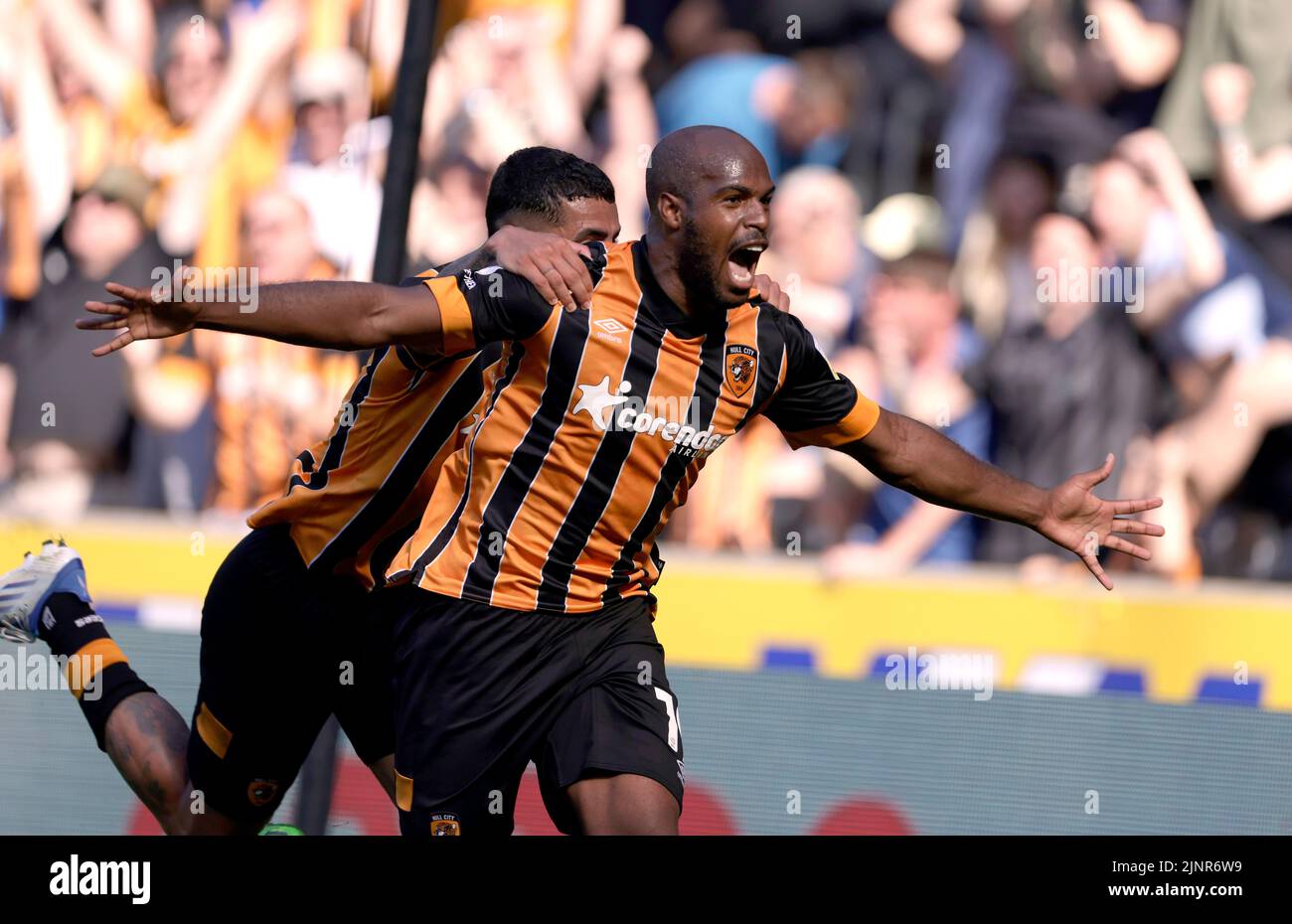 Hull City's Oscar Estupinan celebrates scoring their side's second goal of the game with team-mate Allahyar Sayyadmanesh during the Sky Bet Championship match at the MKM Stadium, Hull. Picture date: Saturday August 13, 2022. Stock Photo
