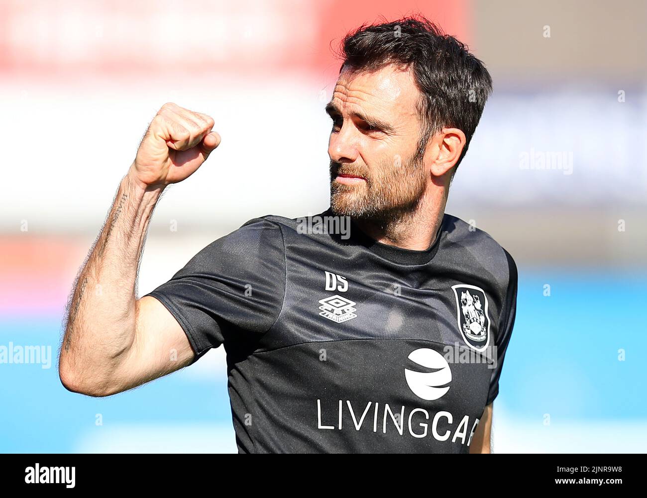 Huddersfield, England, 13th August 2022. Danny Schofield head coach of Huddersfield Town celebrates his win during the Sky Bet Championship match at the John Smith's Stadium, Huddersfield. Picture credit should read: Lexy Ilsley / Sportimage Stock Photo