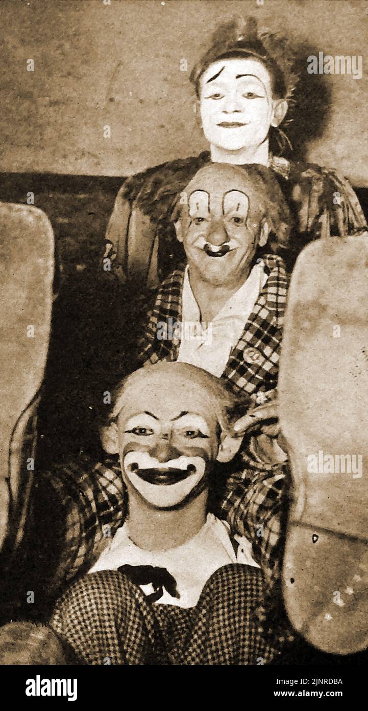 Bertram Mills circus (UK) - Three of its clowns including Coco the Clown (centre) -   Coco the Clown, real name Nicolai Poliakoff OBE ( 900 – 25  1974)  was known in Latvia as Nikolajs Poļakovs and in Russia as Николáй Петрóвич  Полякóв) . He is widely recognised as  the most famous clown in the United Kingdom during  the mid-20th century. He appeared in Bertram Mills circus during the 1920's ,30's  & 40's and  also performed at the Blackpool Tower circus and  toured with Robert Brothers circus.  --  Koko klauna portrets, īstais vārds Николáй Петрóвич Stock Photo