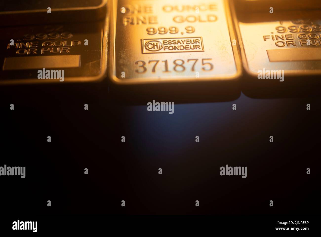 Solid pure 999.9 gold bullion ingot bars photo. Stock Photo