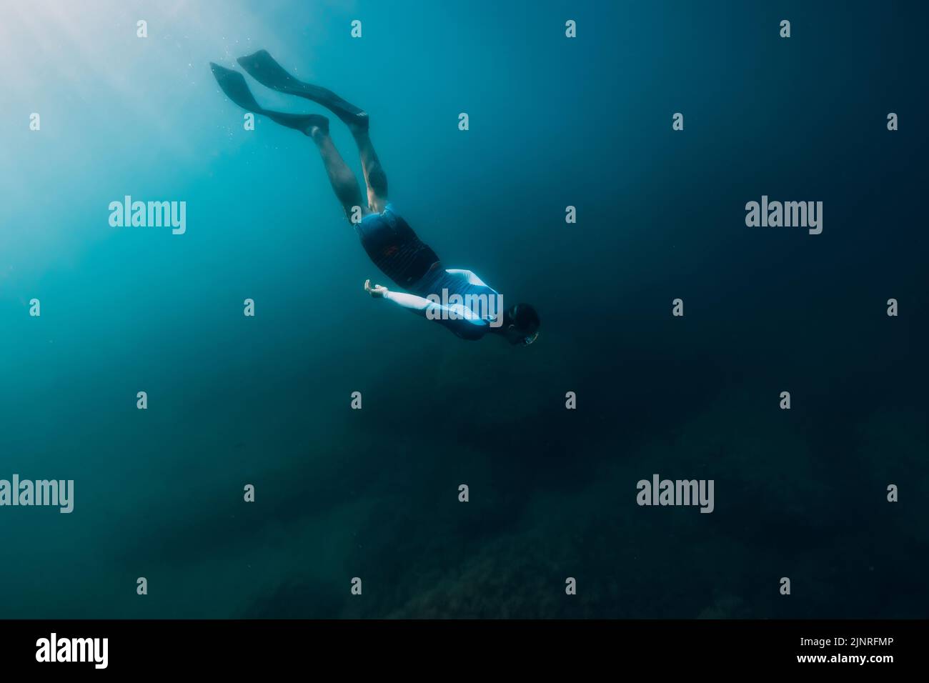 August 07, 2021. Varna, Bulgaria. Men freediver dive with fins in sea. Freediving underwater in transparent sea Stock Photo