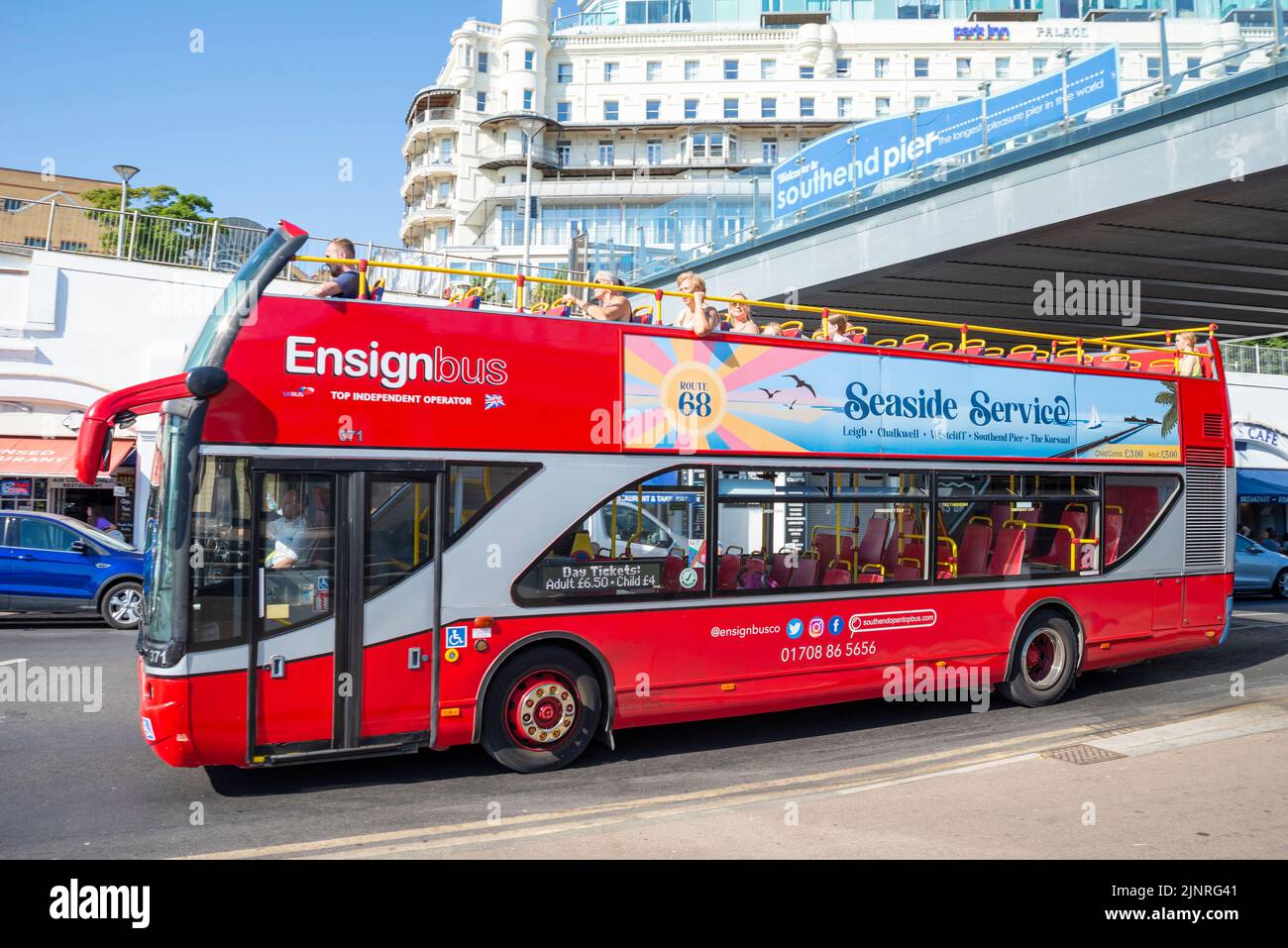 EnsignBus open top bus service in Southend on Sea, Essex, UK. Seaside Service Route 68, passing under Southend Pier, below Park Inn Palace hotel Stock Photo